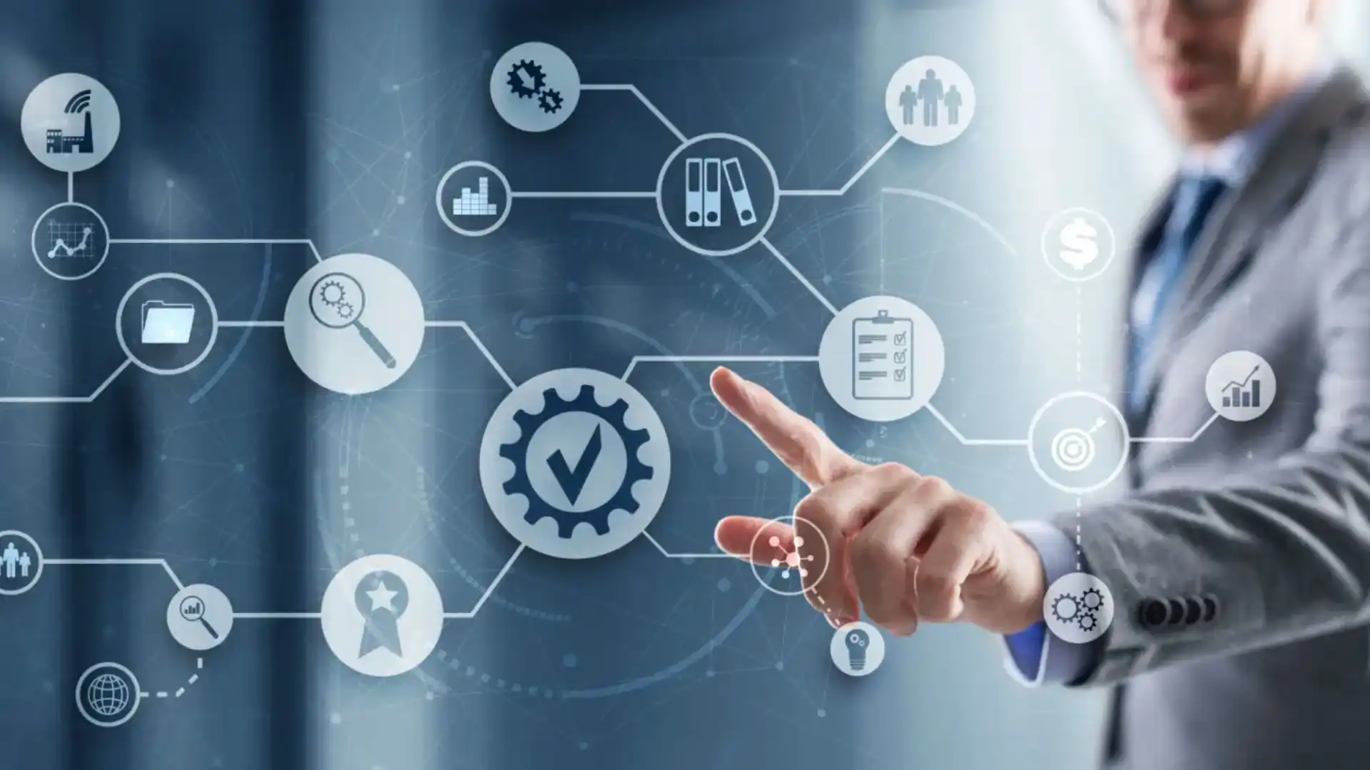 Hand pointing at digital icons representing business and technology concepts.