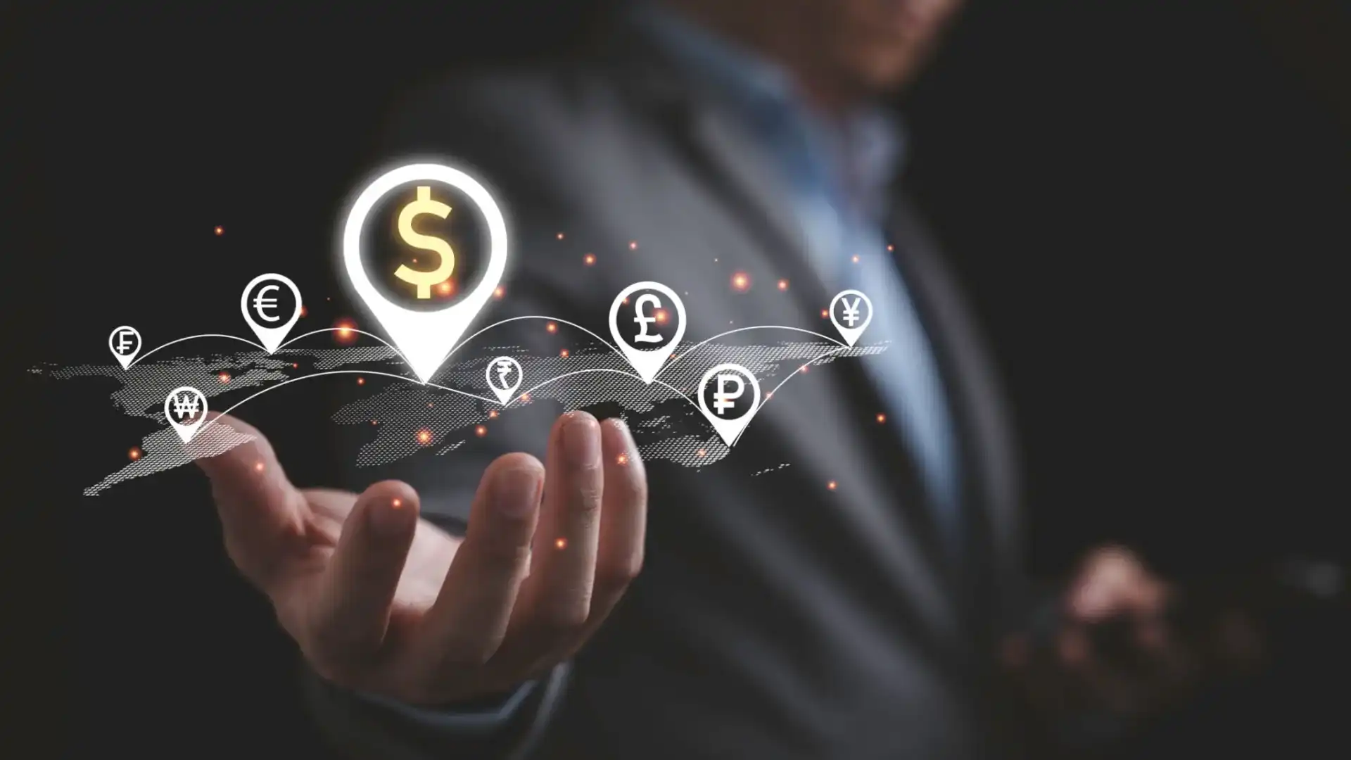 Businessman holding digital currency symbols representing global finance.