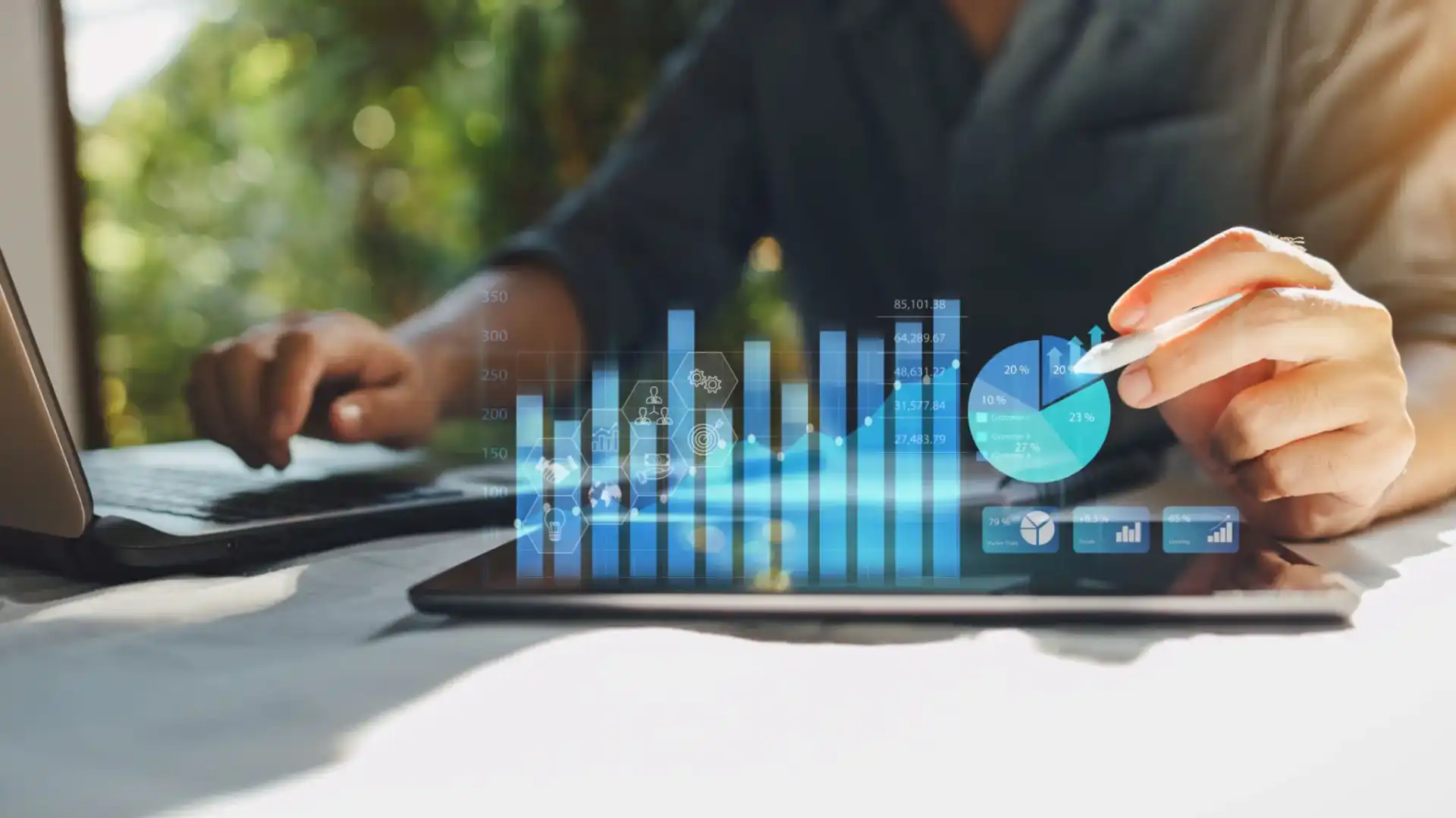Business professionals using tablet with digital financial charts overlay.