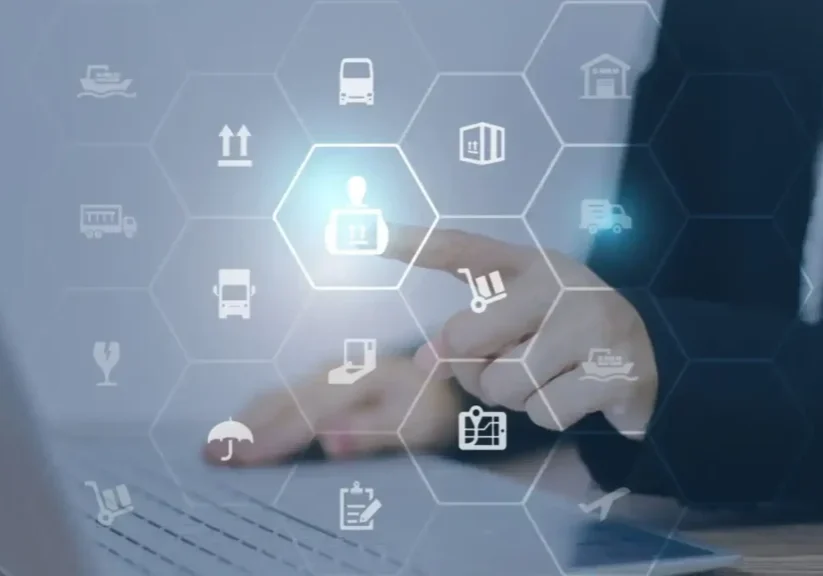 Hand interacting with digital icons representing business and technology.